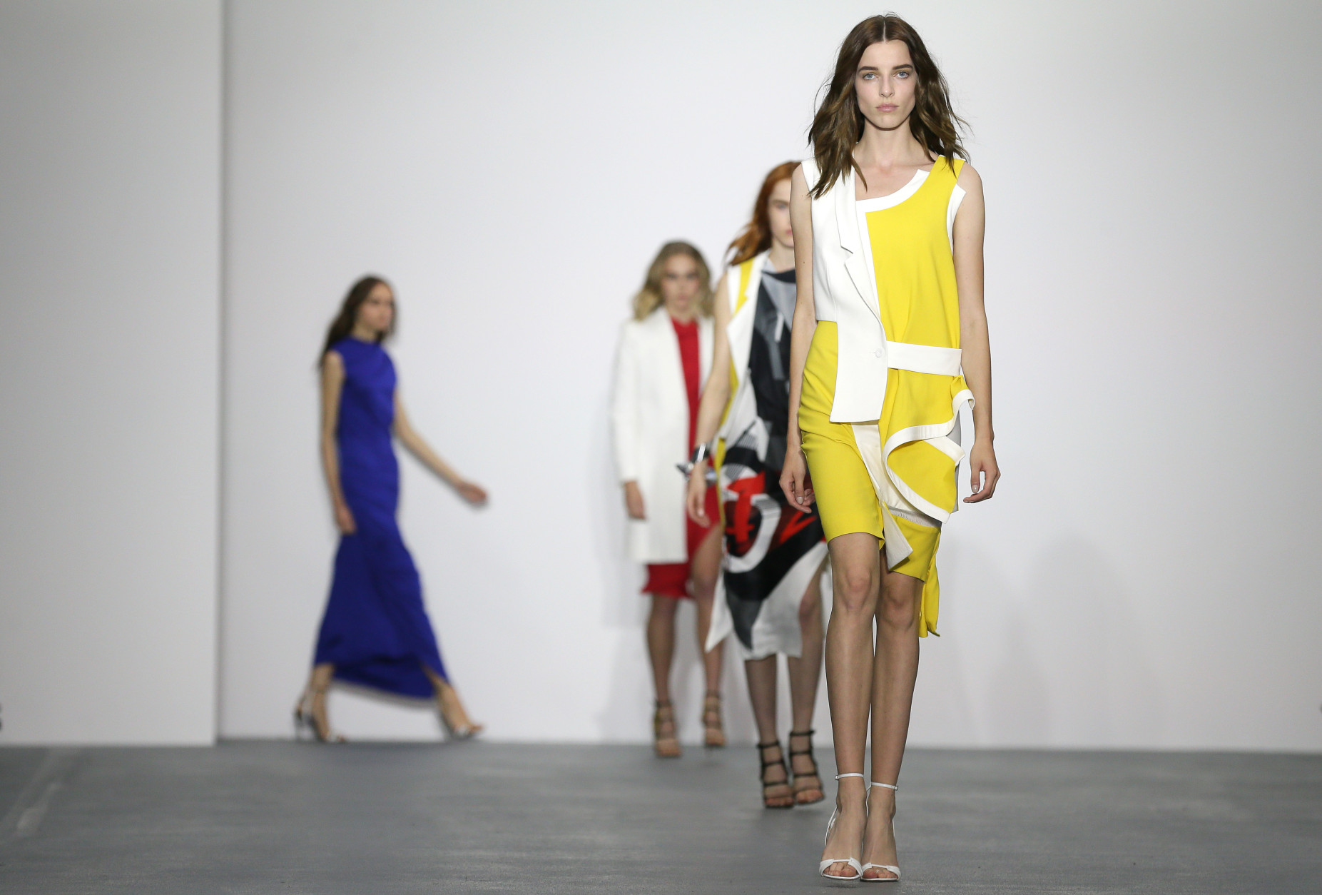 Models wear outfits by designer Jean-Pierre Braganza during the Spring/Summer 2016 show for London Fashion Week at Brewer Street Car Park, in Soho, London, Friday, Sept. 18, 2015. (AP Photo/Tim Ireland)